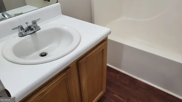 a bathroom with a toilet and a bathtub