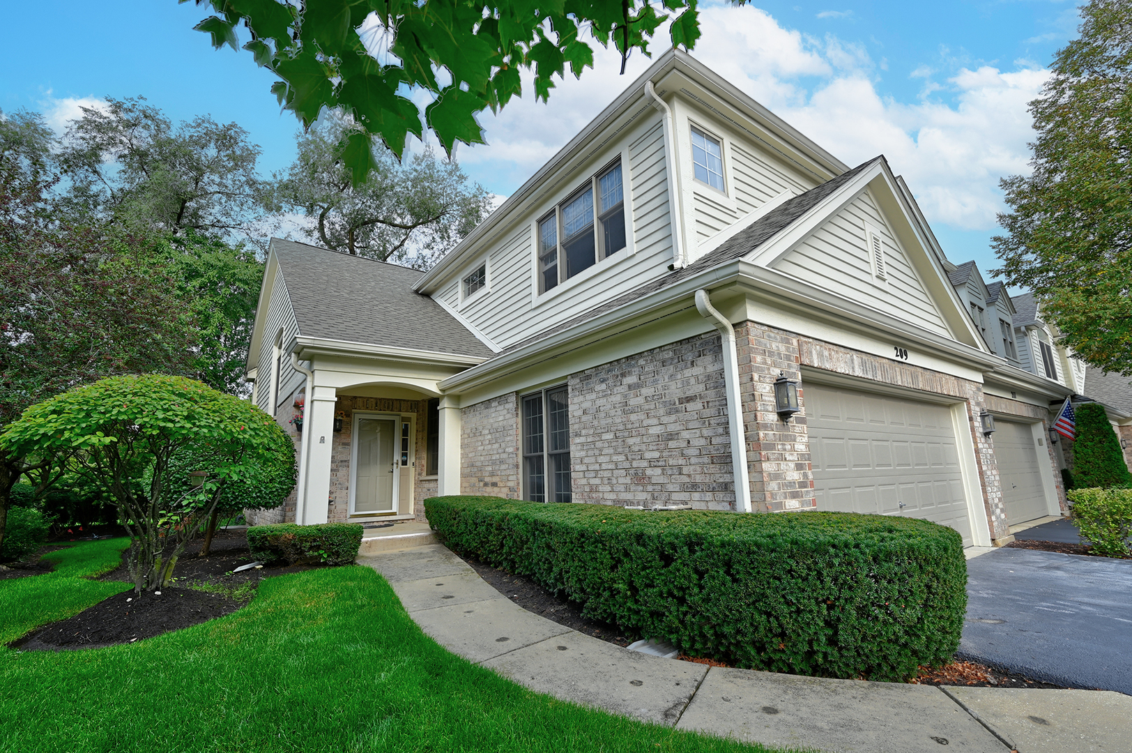 209 Wildflower Lane La Grange, IL 60525 - Photo 1 of 26 a front view of a house with a yard
