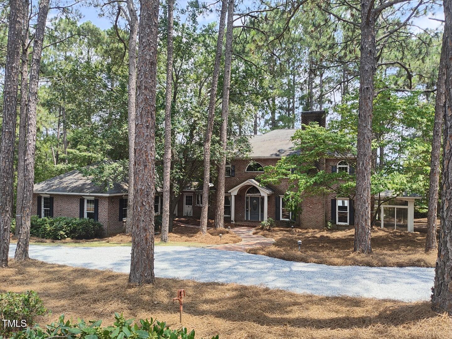 11 Abington Drive Pinehurst, NC 28374 - Photo 1 of 32 a view of a house with a tree in front of it