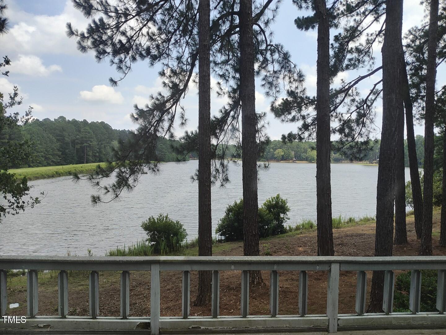 11 Abington Drive Pinehurst, NC 28374 - Photo 13 of 32 a view of a lake with a tree