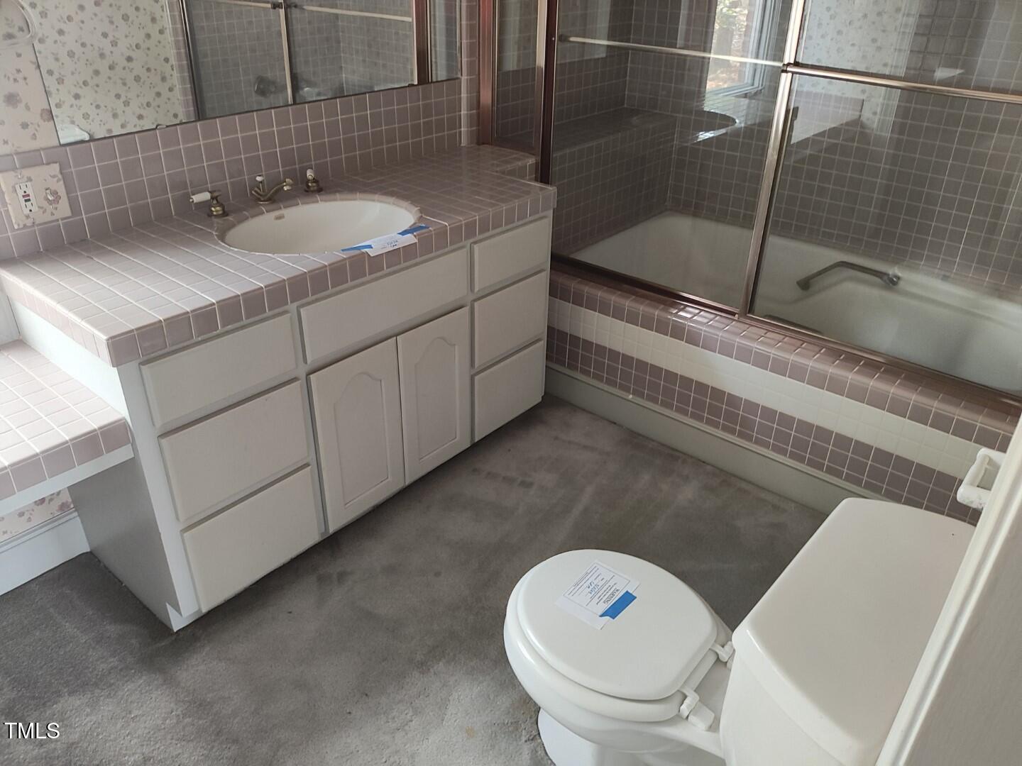 11 Abington Drive Pinehurst, NC 28374 - Photo 29 of 32 a bathroom with a sink toilet and shower