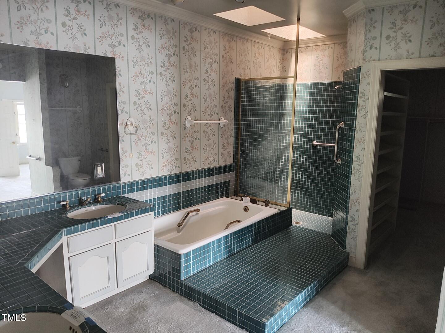 11 Abington Drive Pinehurst, NC 28374 - Photo 10 of 32 a bathroom with a sink a toilet and shower