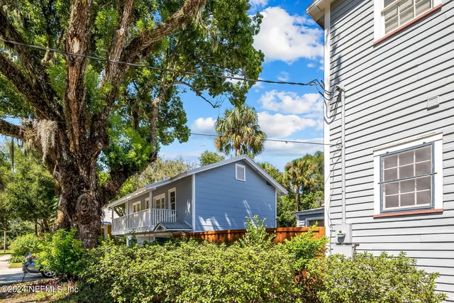 a house view with a backyard space