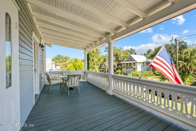 a view of two chairs in the balcony