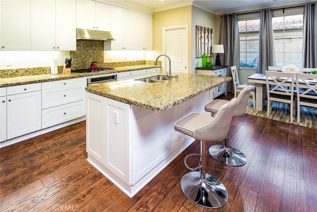 75 Gardenstone Path Irvine, CA 92620 - Photo 9 of 65 a kitchen with stainless steel appliances granite countertop a stove a sink and a refrigerator