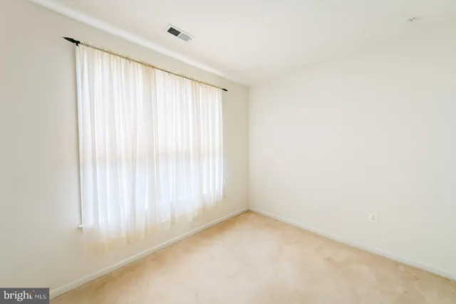 a white toilet sitting next to a shower