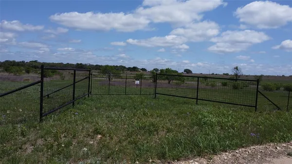 a view of a road with a yard