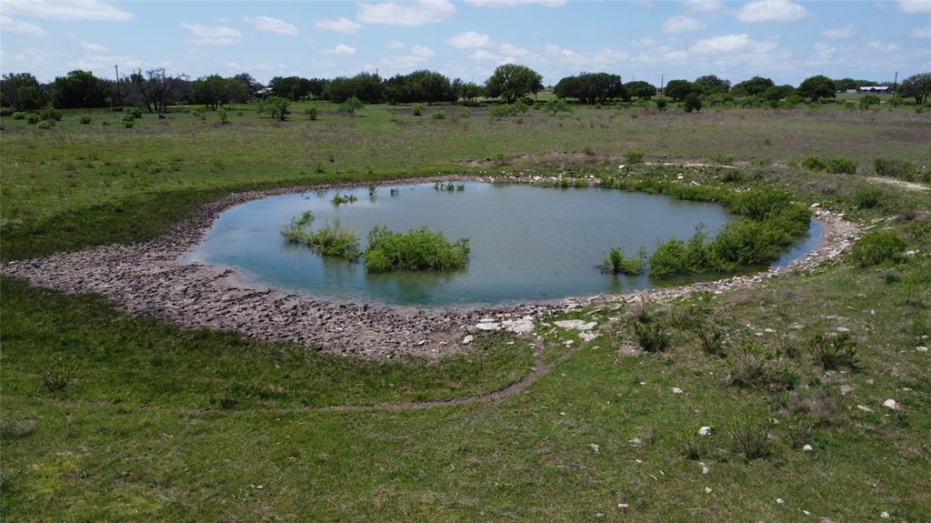 1702 St Energy Tx 76452 Gustine, TX 76455 - Photo 11 of 17 an aerial view of a houses with outdoor space and lake view