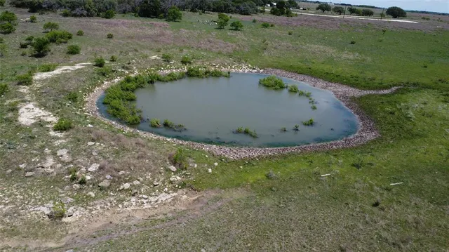 an aerial view of valley and lake