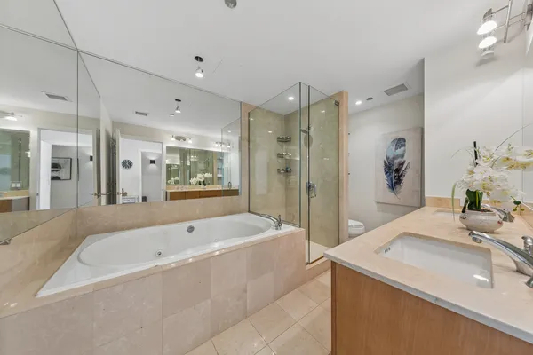 a bathroom with a bathtub and a sink