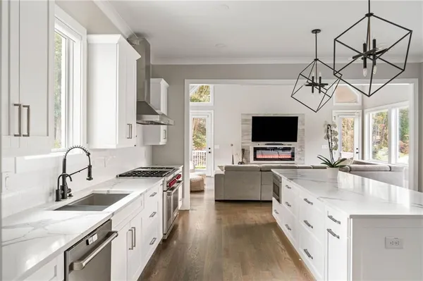 a bedroom with furniture and a large window