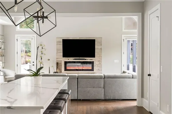 a view of a livingroom with furniture and hardwood floor