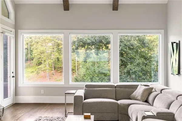 a bedroom with a large bed and a window