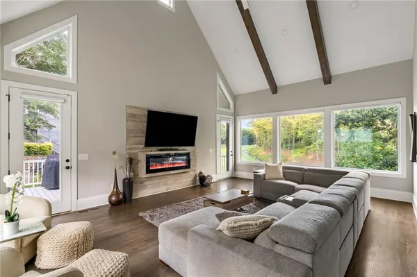 a bathroom with a granite countertop sink and a large mirror