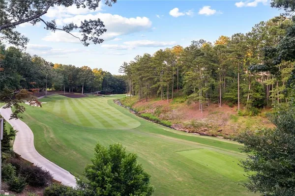 a view of a bathroom with a sink and a mirror