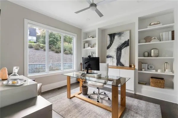 a bed room with a bed a dresser and a window