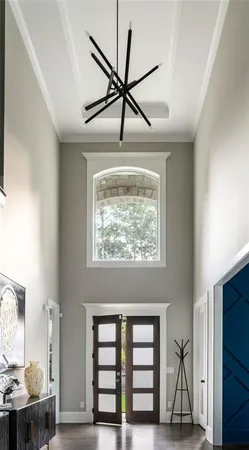 a room with furniture pool table and flat screen