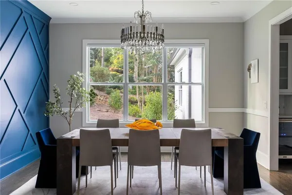 a room with furniture a flat screen tv and a table