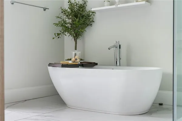 a living room with furniture and a walk in closet