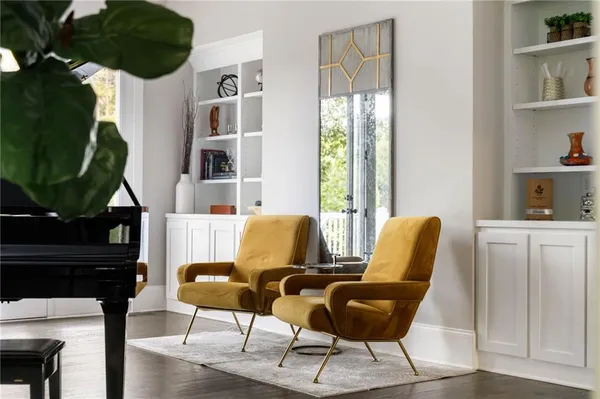 a kitchen with a sink a stove a dining table and chairs