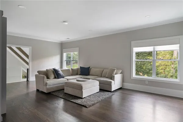 an aerial view of residential house with outdoor space and trees all around