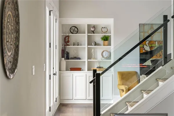 a view of a dining room with furniture and a large window
