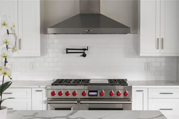 a living room with a fireplace and a flat screen tv