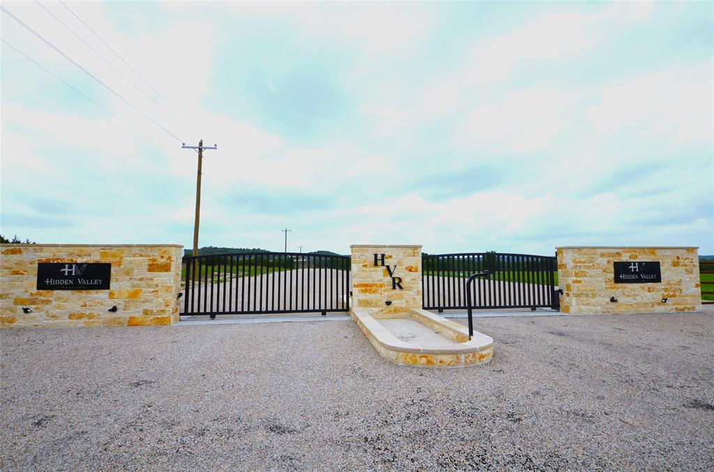 1239 Hidden Rock Road Glen Rose, TX 76043 - Photo 11 of 16 a view of a swimming pool with a slide