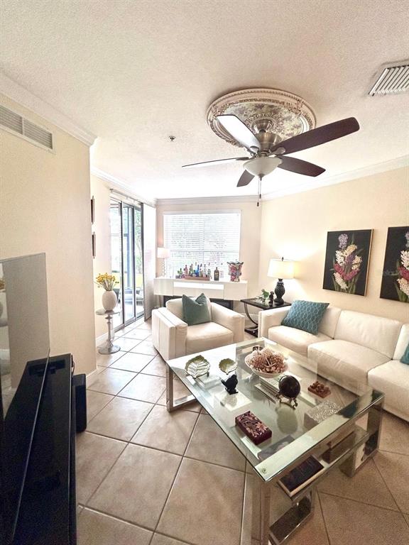 8168 Boat Hook Loop, Unit 107 Windermere, FL 34786 - Photo 15 of 25 a living room with lots of furniture and a large window