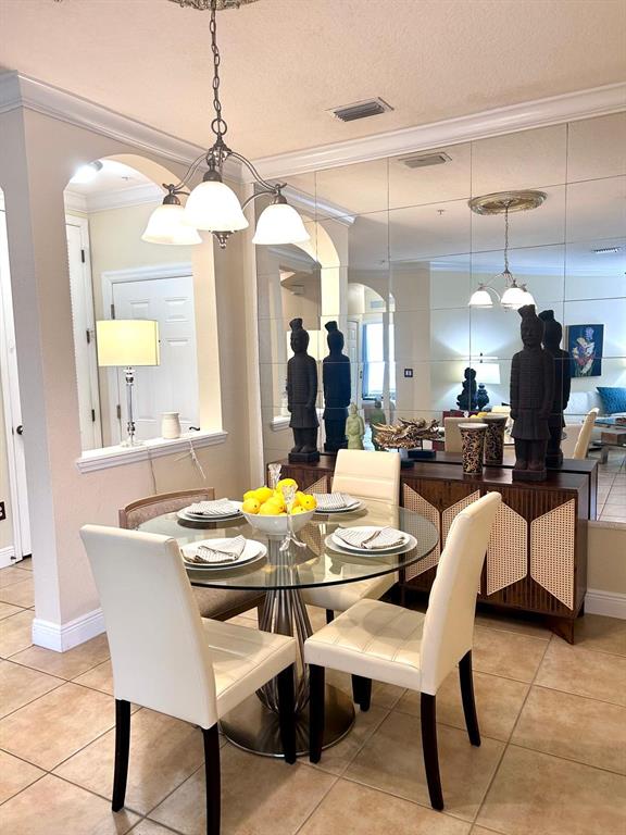 8168 Boat Hook Loop, Unit 107 Windermere, FL 34786 - Photo 21 of 25 a view of a dining room with furniture