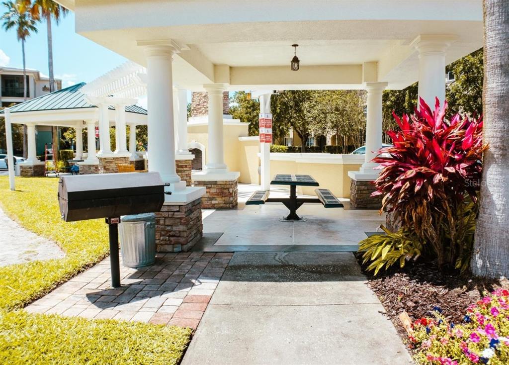 8168 Boat Hook Loop, Unit 107 Windermere, FL 34786 - Photo 25 of 25 a living room with fireplace furniture and a large window