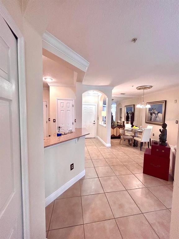 8168 Boat Hook Loop, Unit 107 Windermere, FL 34786 - Photo 6 of 25 a living room with furniture and a dining table