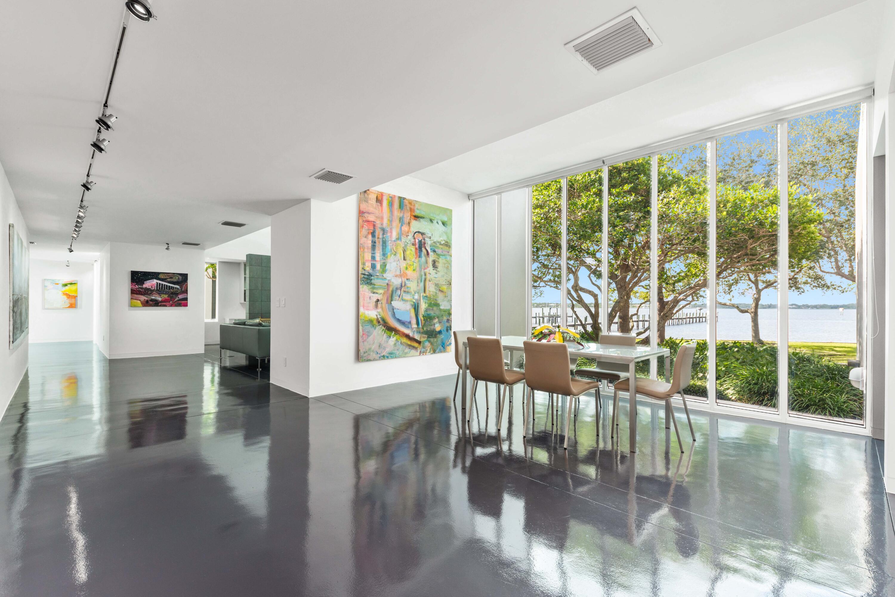 1924 Northwest Shore Terrace Stuart, FL 34994 - Photo 11 of 33 a living room with fireplace furniture and a large window