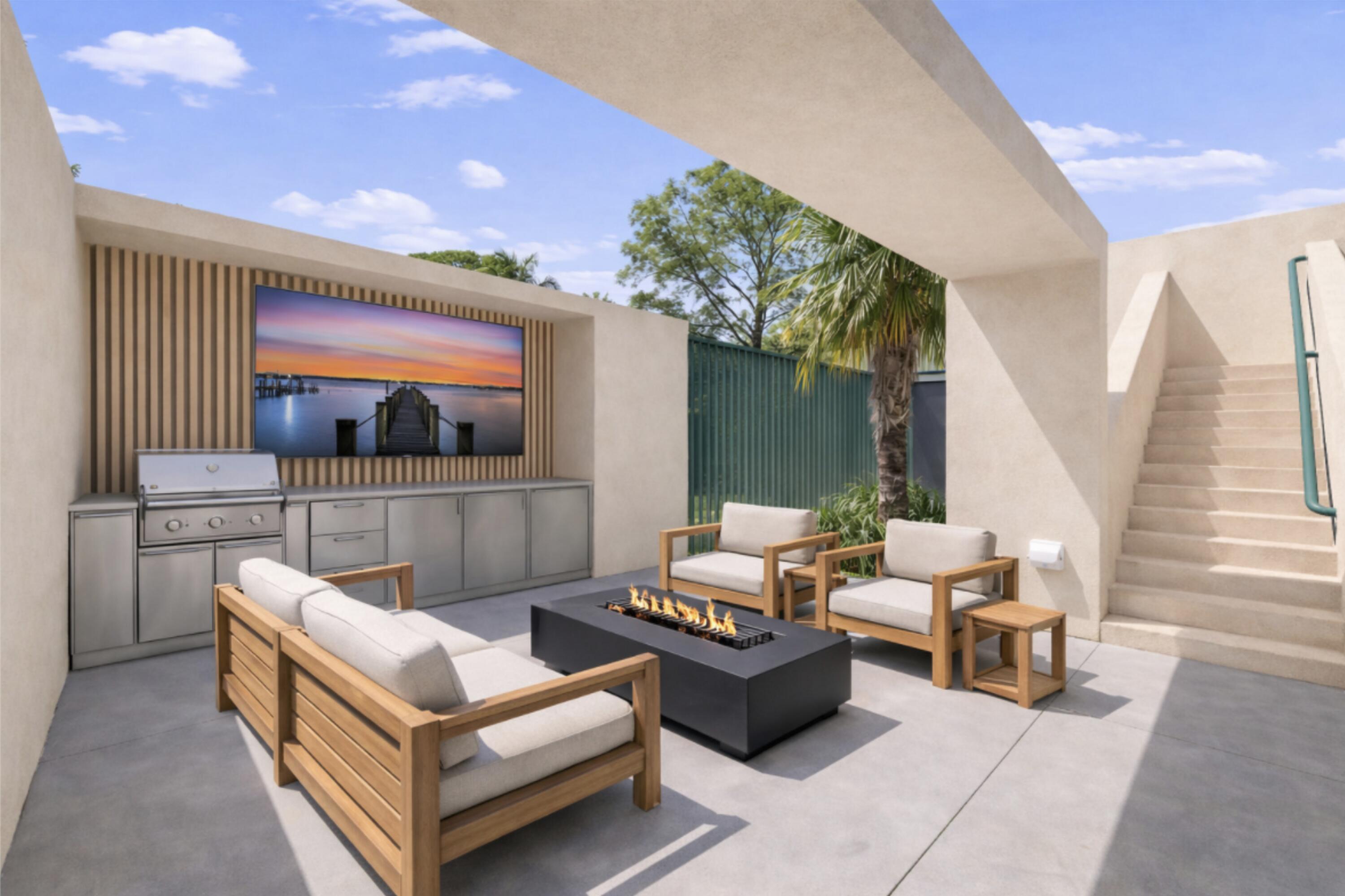 1924 Northwest Shore Terrace Stuart, FL 34994 - Photo 25 of 33 a outdoor living space with furniture and a flat screen tv