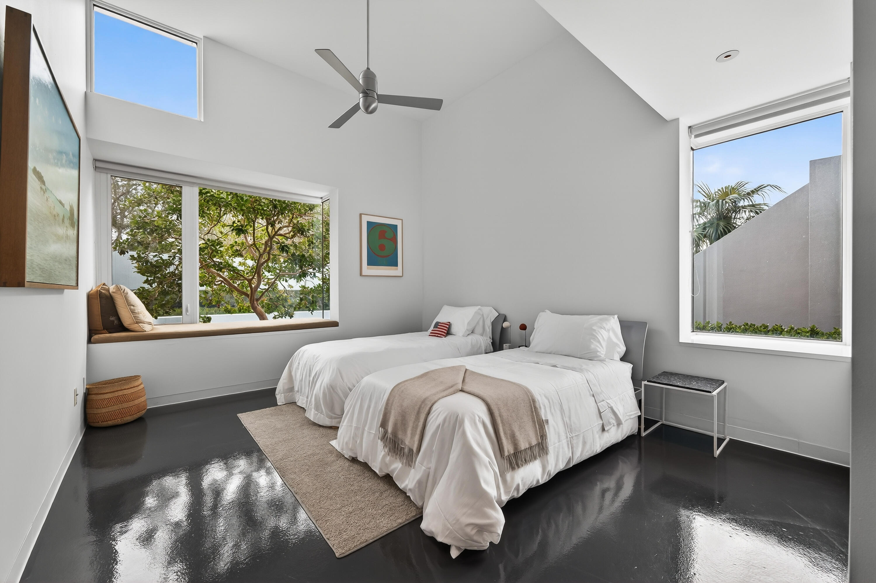 1924 Northwest Shore Terrace Stuart, FL 34994 - Photo 27 of 33 a bedroom with a bed and a large window