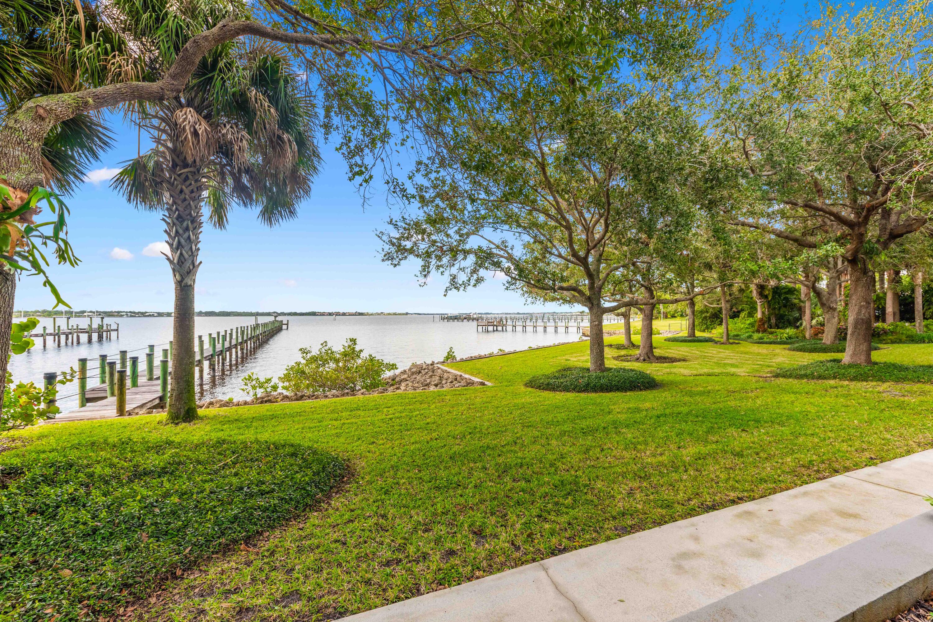 1924 Northwest Shore Terrace Stuart, FL 34994 - Photo 31 of 33 a view of a garden with a tree