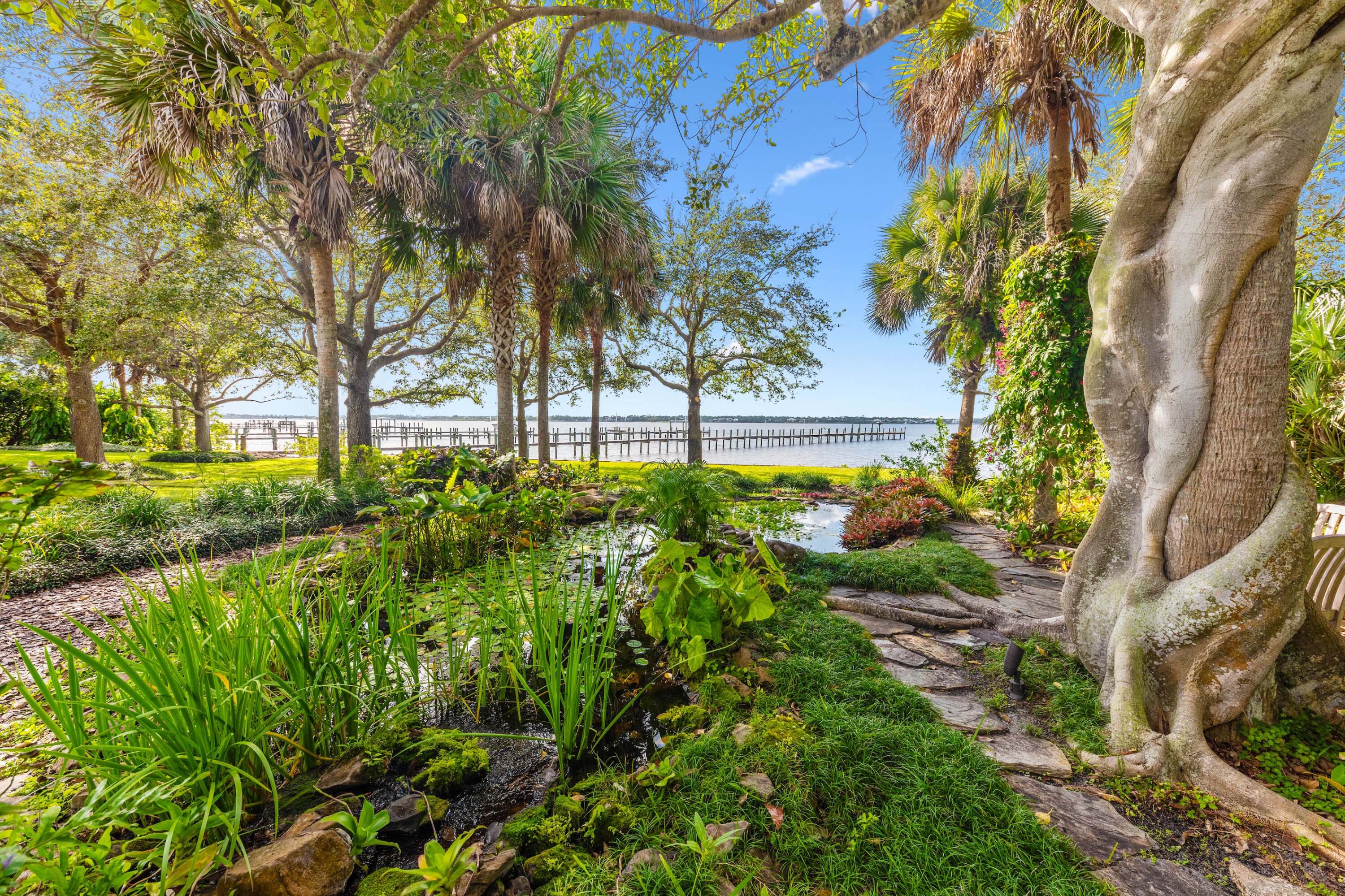 1924 Northwest Shore Terrace Stuart, FL 34994 - Photo 32 of 33 a view of a garden with plants
