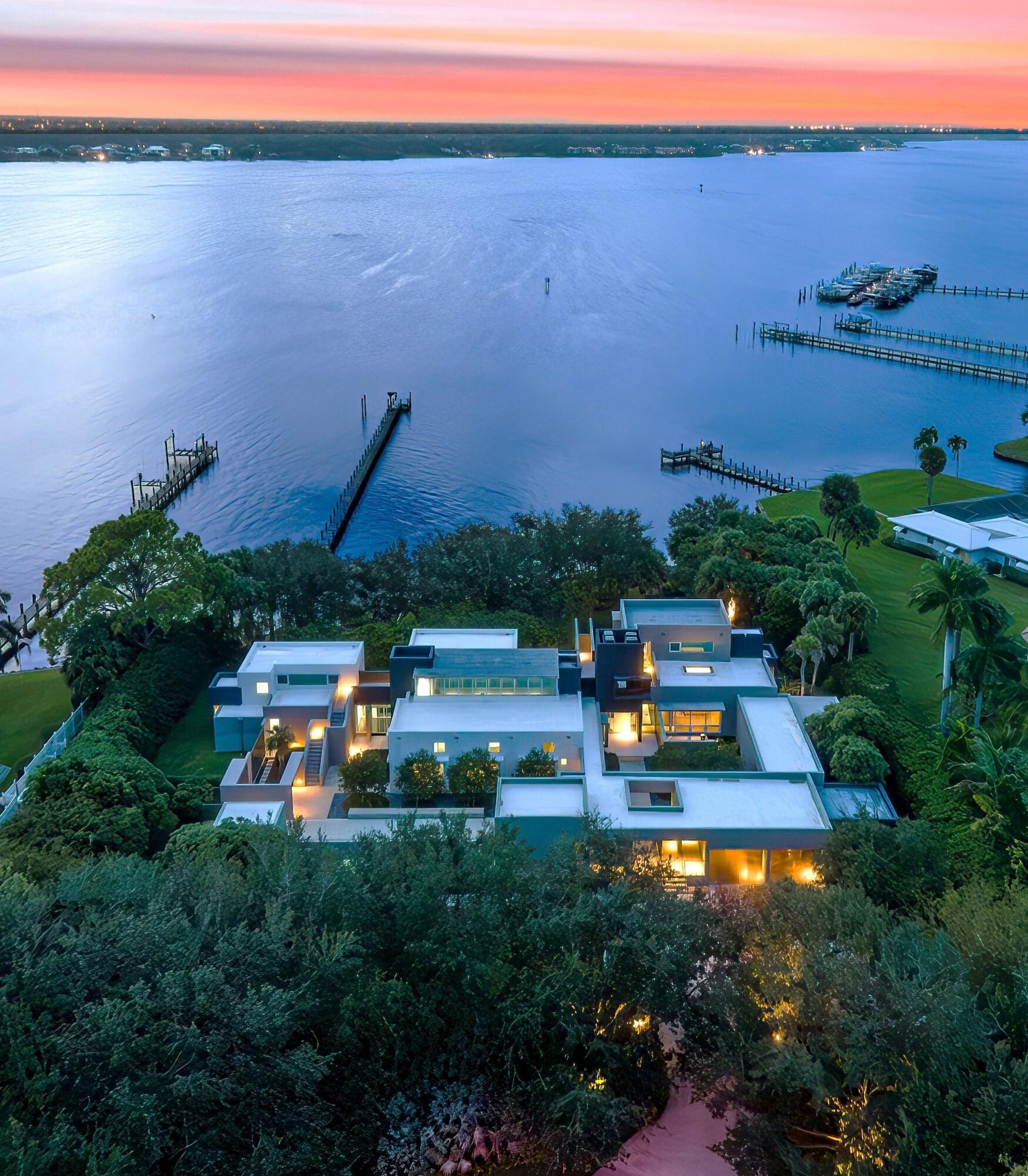 1924 Northwest Shore Terrace Stuart, FL 34994 - Photo 33 of 33 an aerial view of a house with garden space and outdoor seating