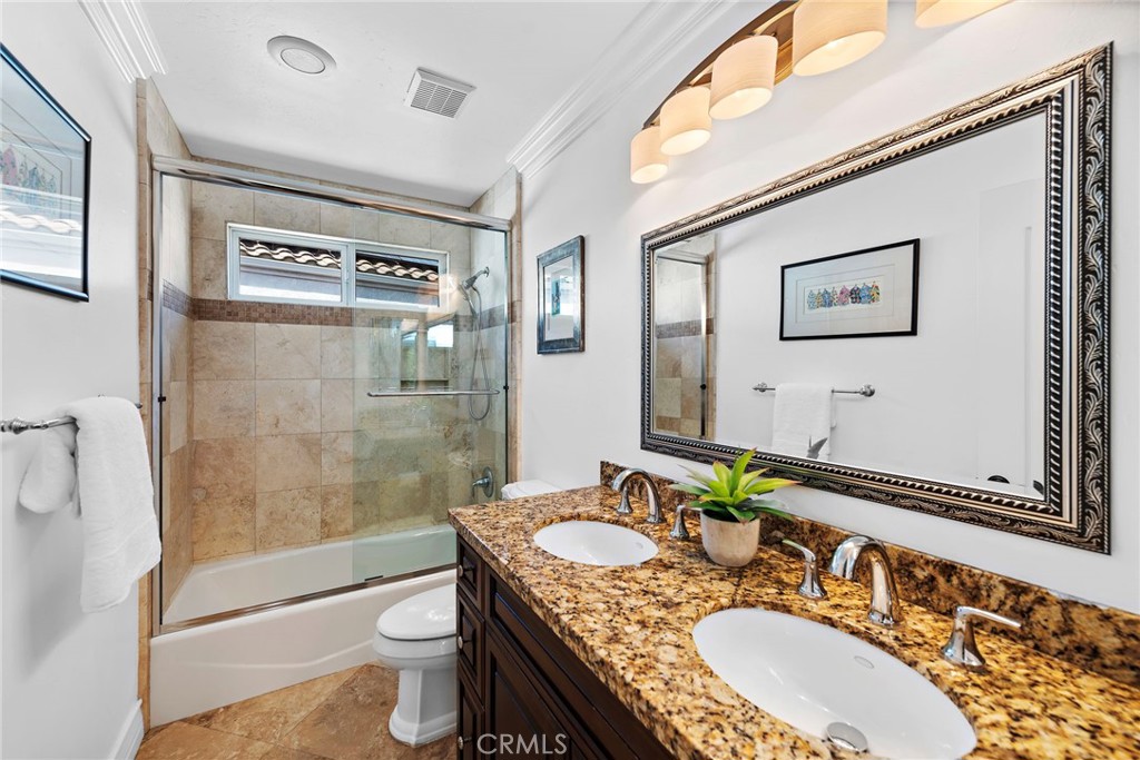 20 Regina Dana Point, CA 92629 - Photo 22 of 26 a bathroom with a granite countertop sink toilet and shower