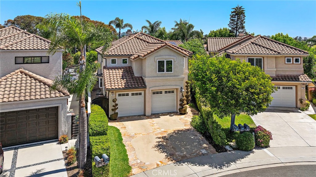 20 Regina Dana Point, CA 92629 - Photo 24 of 26 a front view of a house with a garden