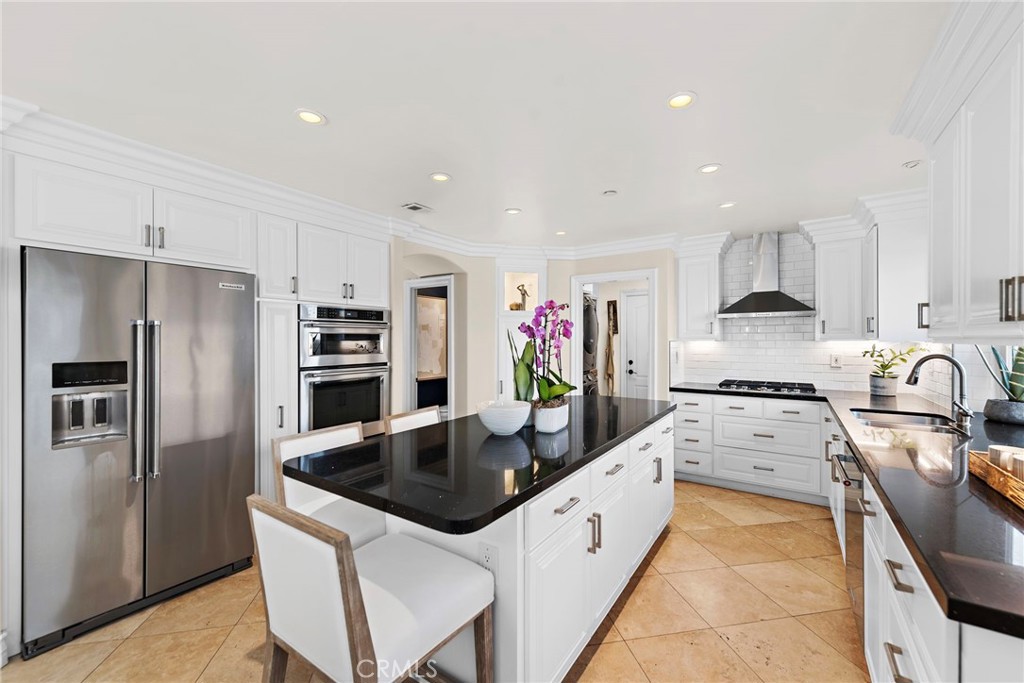 20 Regina Dana Point, CA 92629 - Photo 7 of 26 a kitchen with stainless steel appliances granite countertop a sink stove and refrigerator