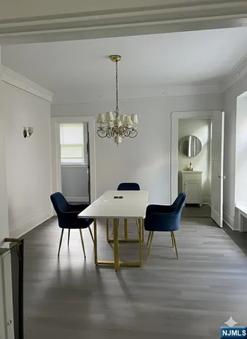 a view of a livingroom with furniture and chandelier