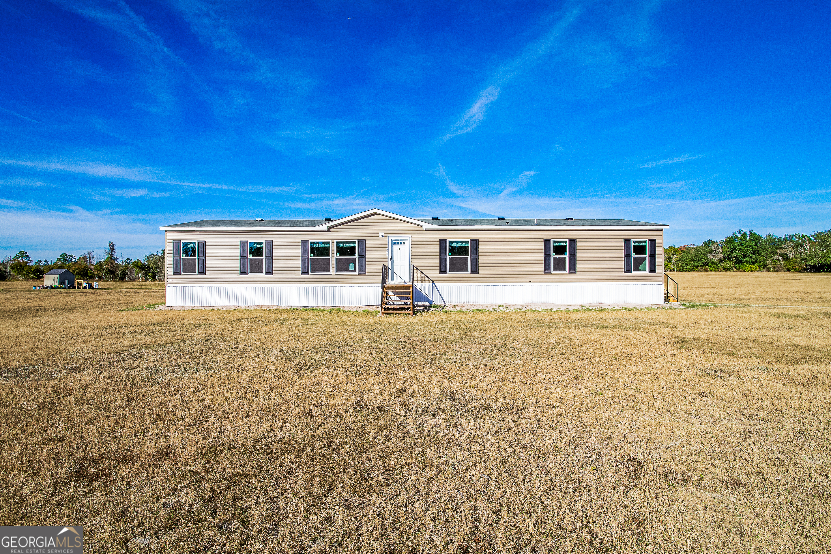 a house view with swimming pool in front of it