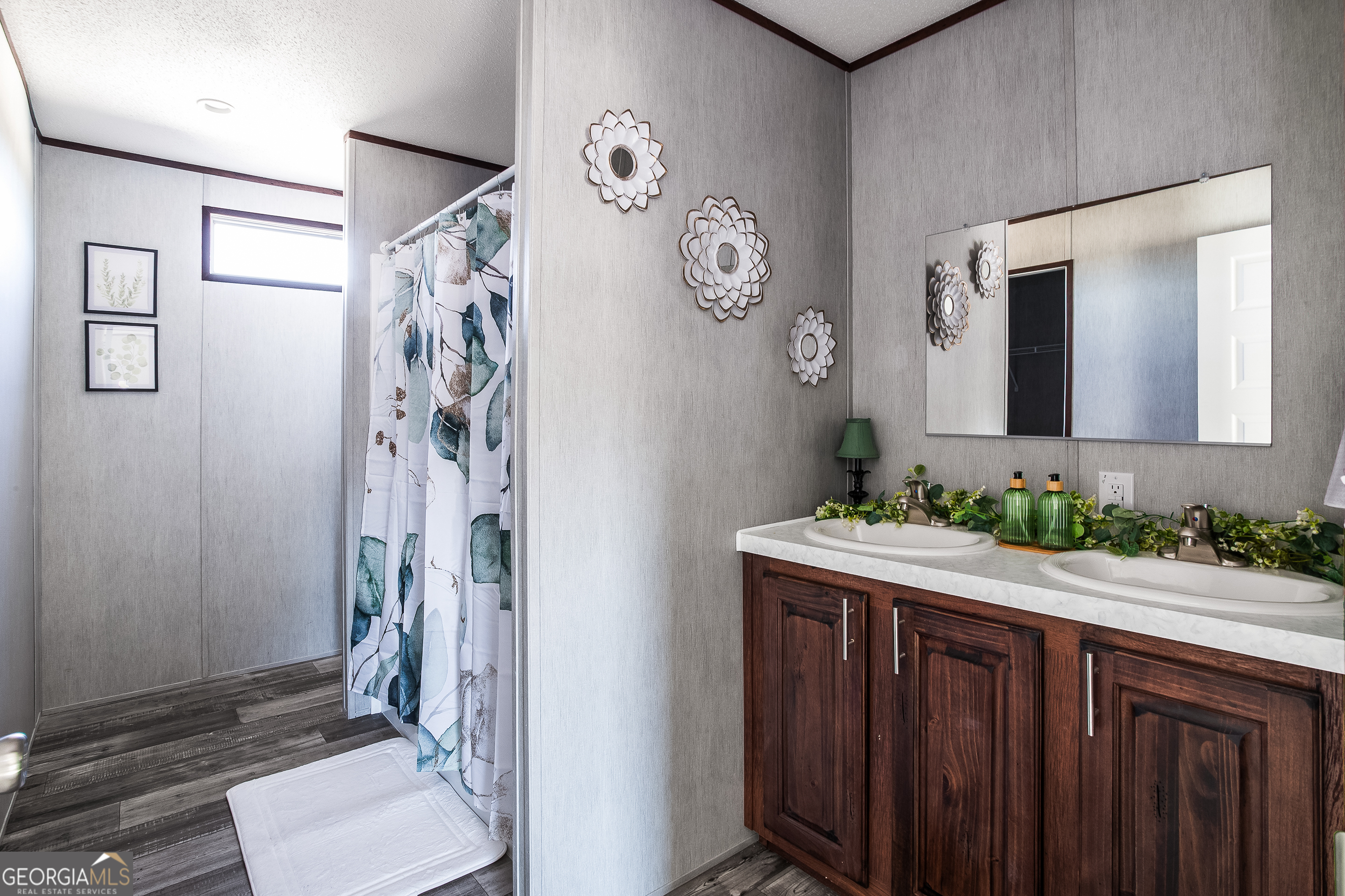 373 Barber Branch St. George, GA 31562 - Photo 12 of 30 a bathroom with a sink and a mirror