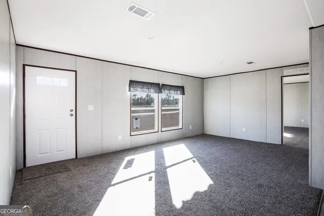 an empty room with windows