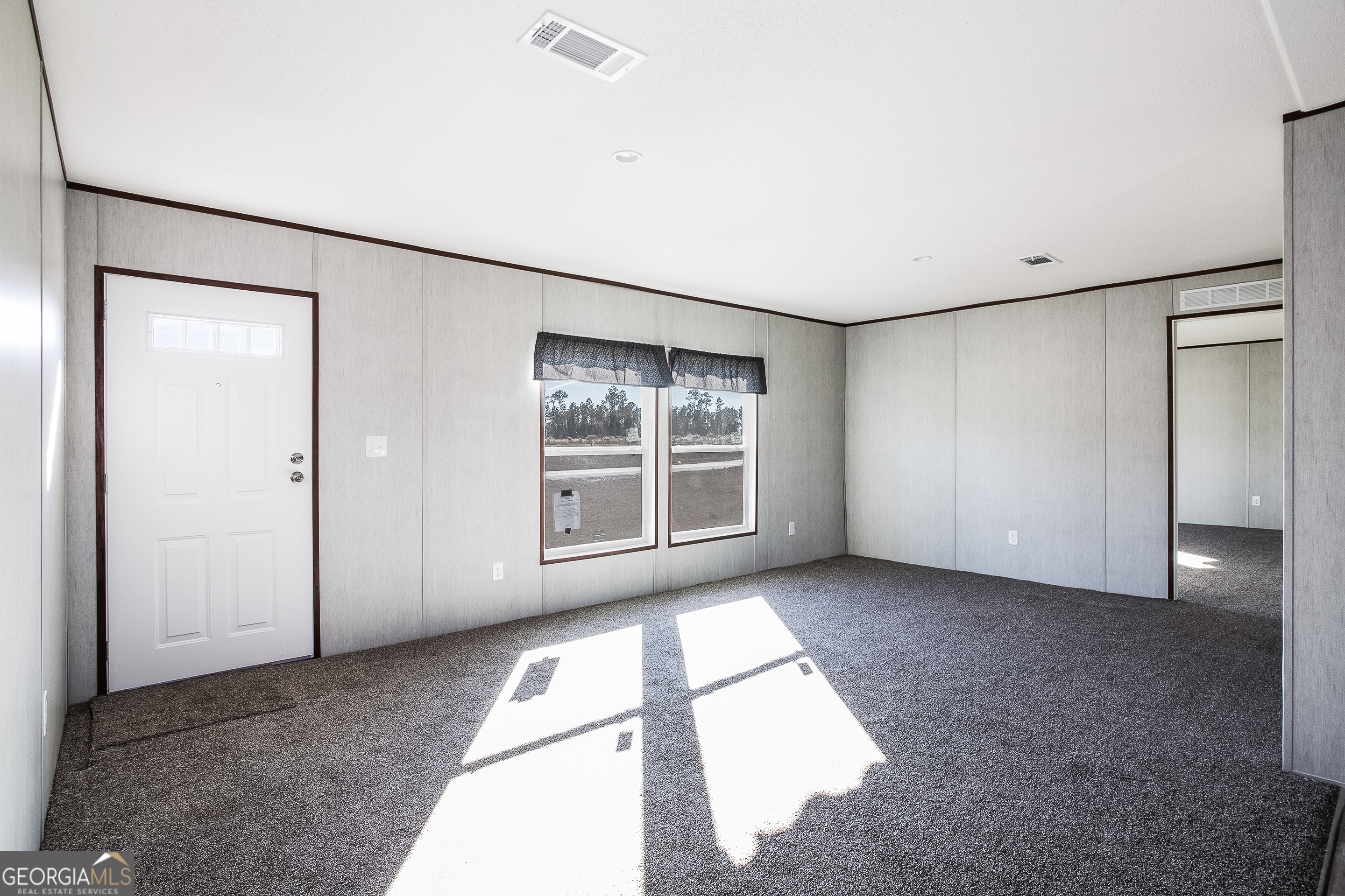 373 Barber Branch St. George, GA 31562 - Photo 15 of 30 an empty room with windows