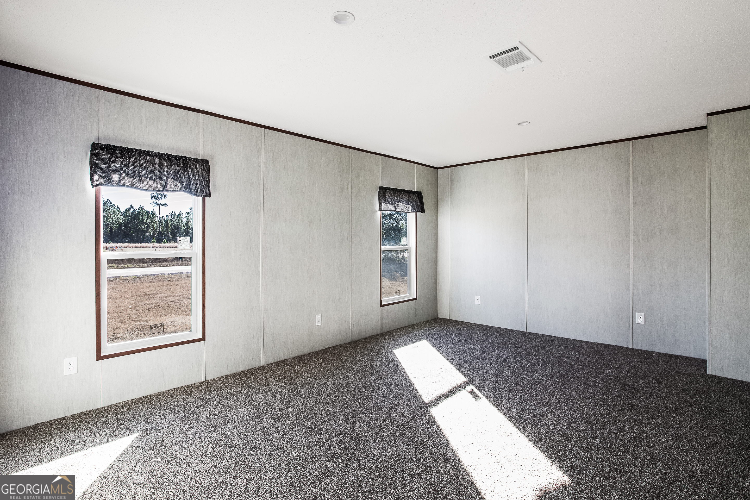 373 Barber Branch St. George, GA 31562 - Photo 16 of 30 a view of an empty room with a window