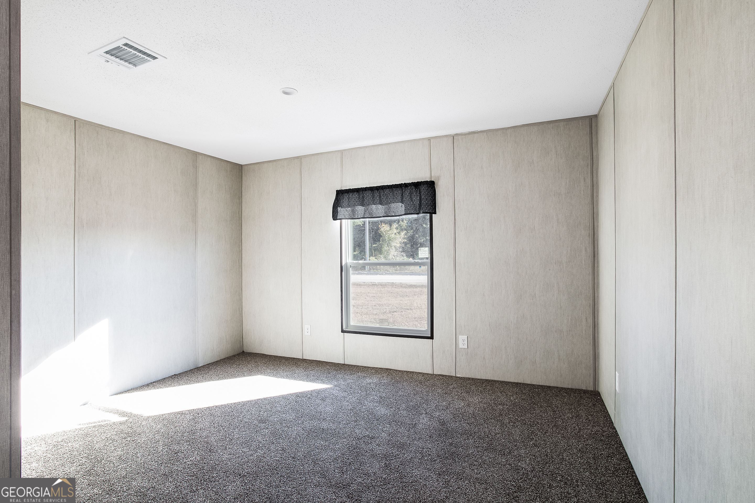 373 Barber Branch St. George, GA 31562 - Photo 18 of 30 a view of an empty room with a window