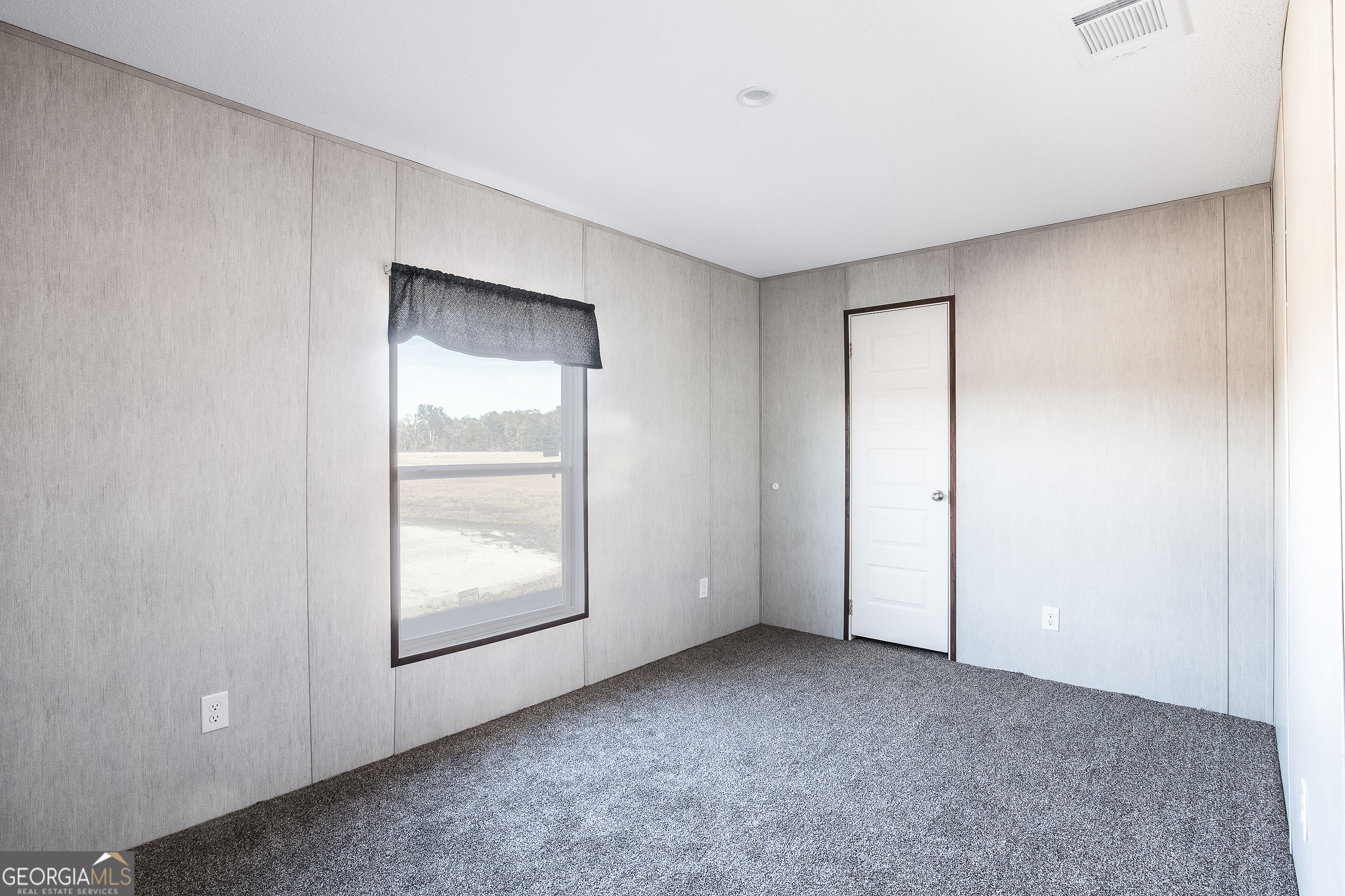 373 Barber Branch St. George, GA 31562 - Photo 19 of 30 a view of an empty room with window