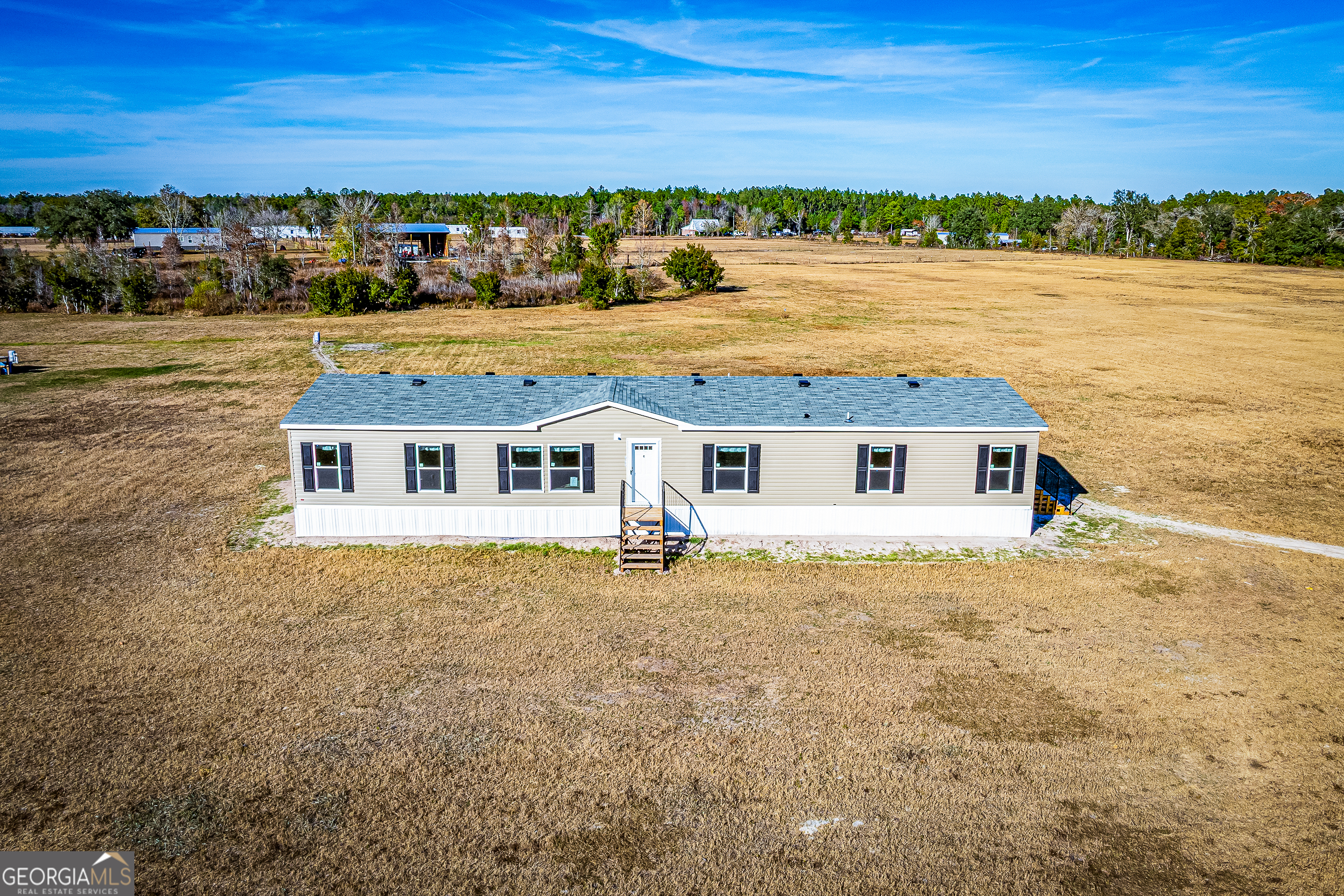 373 Barber Branch St. George, GA 31562 - Photo 2 of 30 an aerial view of a house with a lake view